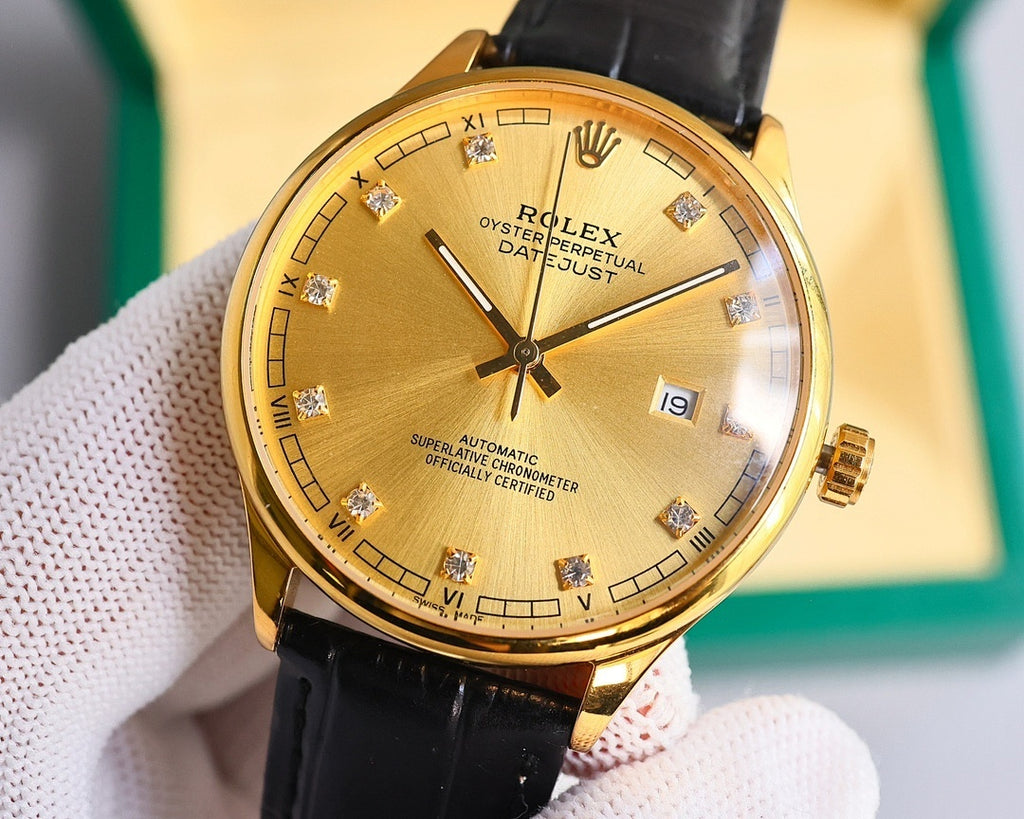 Gold-tone wristwatch with black leather strap, gold dial and Roman numerals, date window