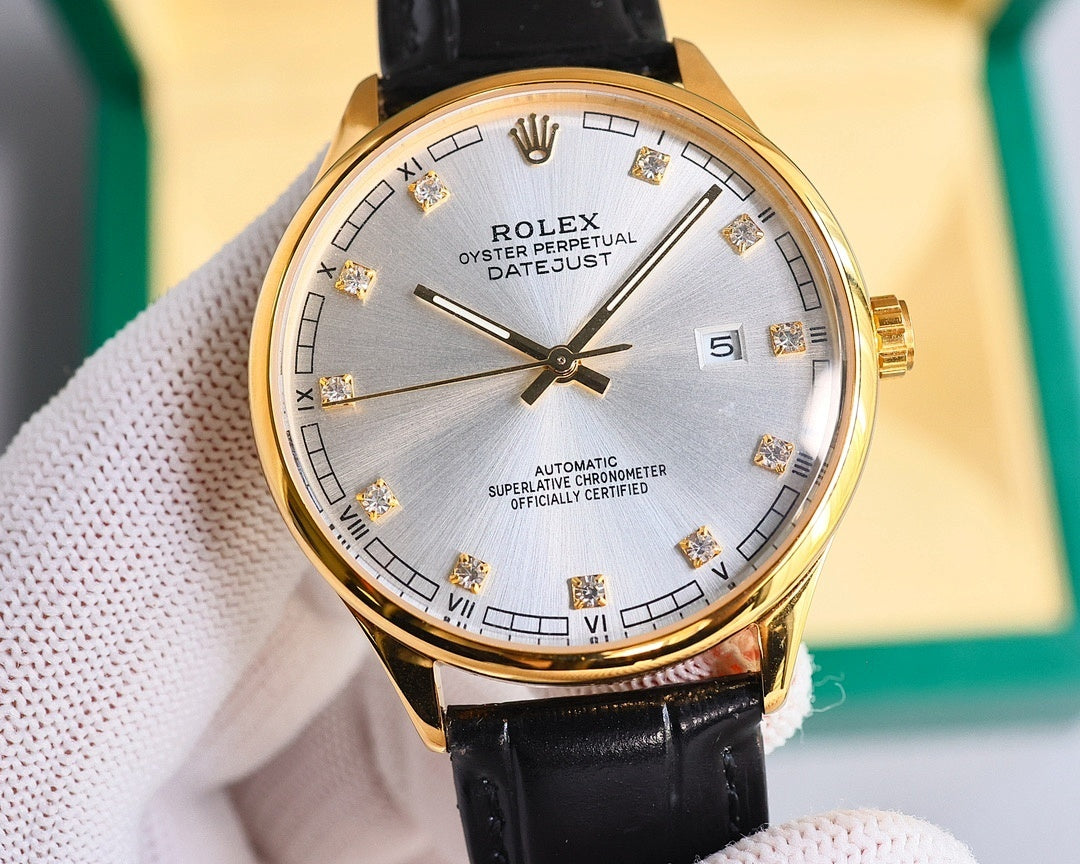 Gold-tone wristwatch with black leather strap, white dial, Roman numerals and date window
