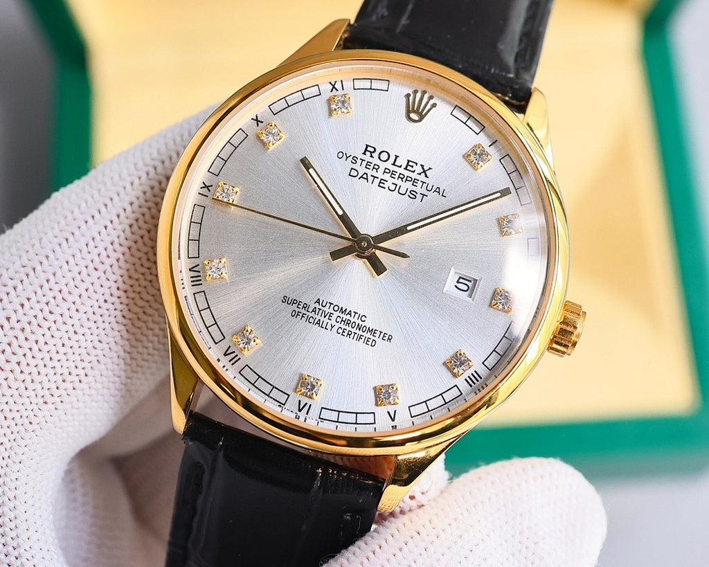 Gold-tone wristwatch with black leather strap, silver dial and Roman numerals