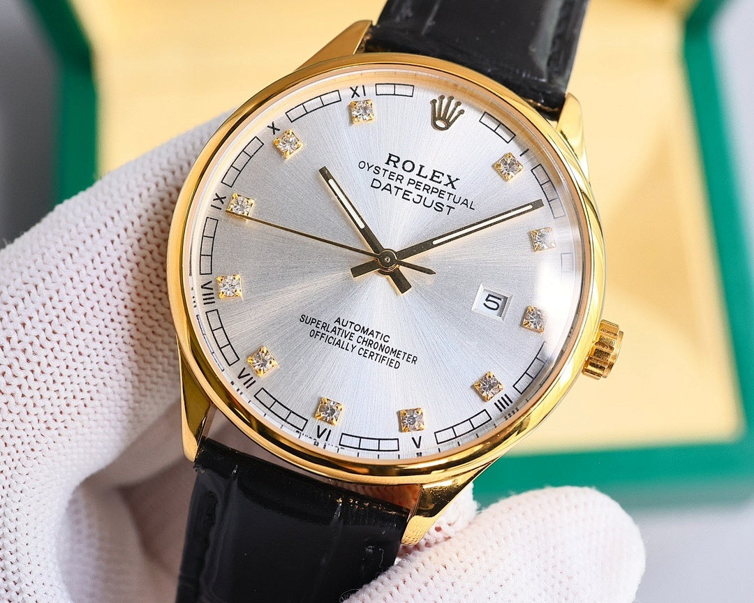 Gold-tone wristwatch with black leather strap, silver dial and Roman numerals