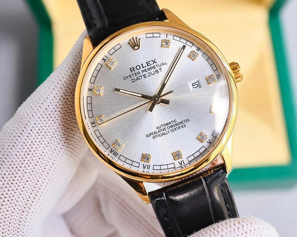 Gold-tone wristwatch with black leather strap, silver dial and Roman numerals, tilted view