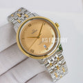 Two-tone wristwatch with gold-tone bezel, champagne dial, and metal link bracelet