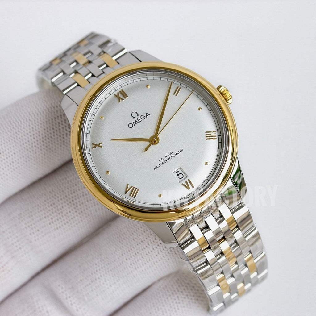 Two-tone wristwatch with light dial, gold-tone bezel, and metal link bracelet