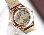 Omega watch case back in rose gold tone with visible movement and stainless text
