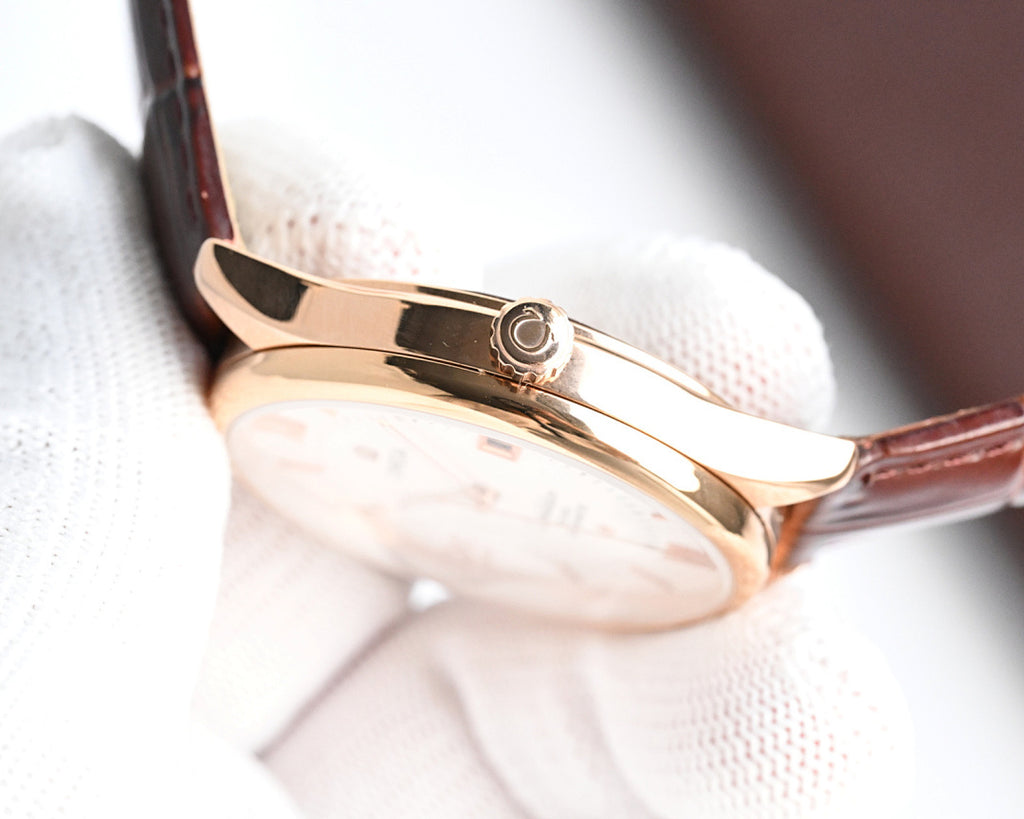 Omega watch with rose gold case and brown leather strap, side profile and crown