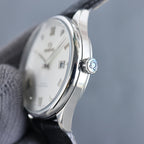 Wristwatch case with crown, polished silver finish and black leather strap