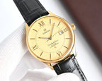 Omega watch with black leather strap, gold case, champagne dial, date window