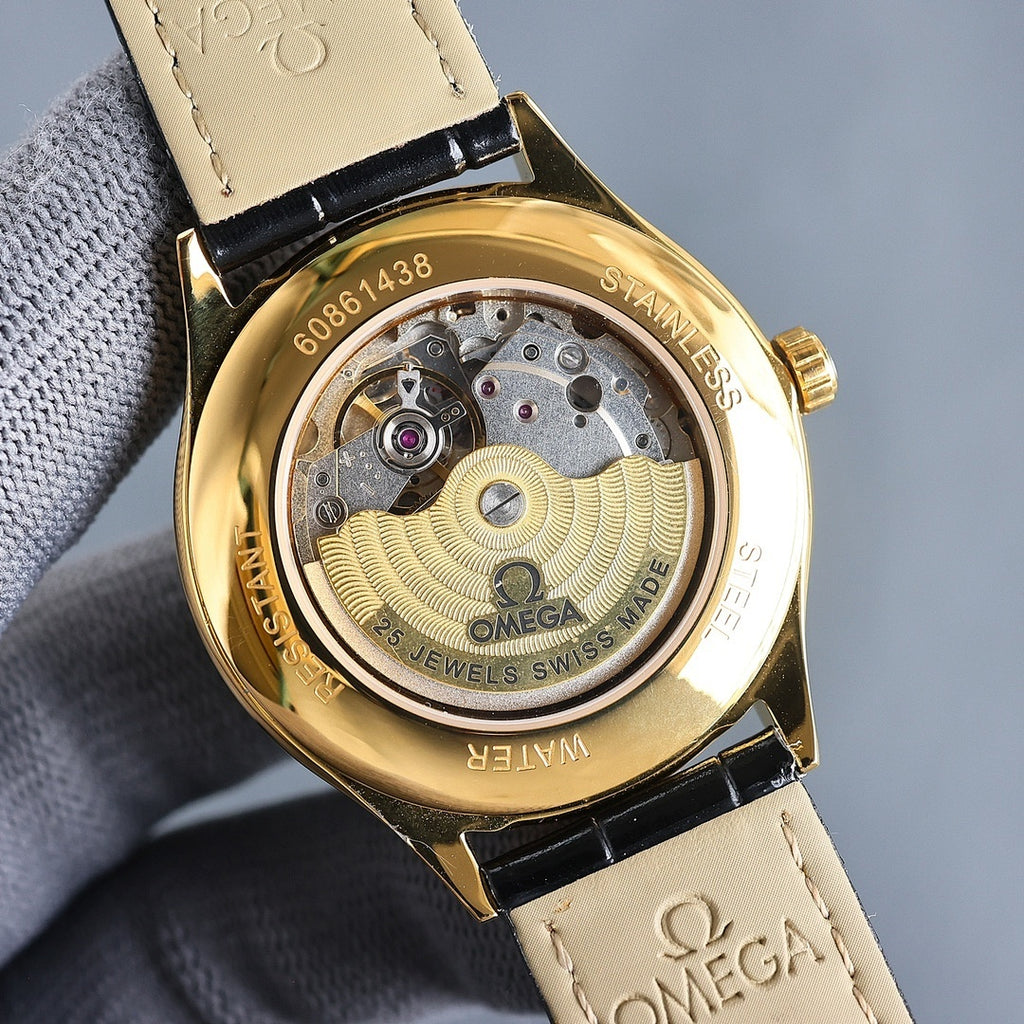 Omega wristwatch case back with gold dial and visible mechanical movement