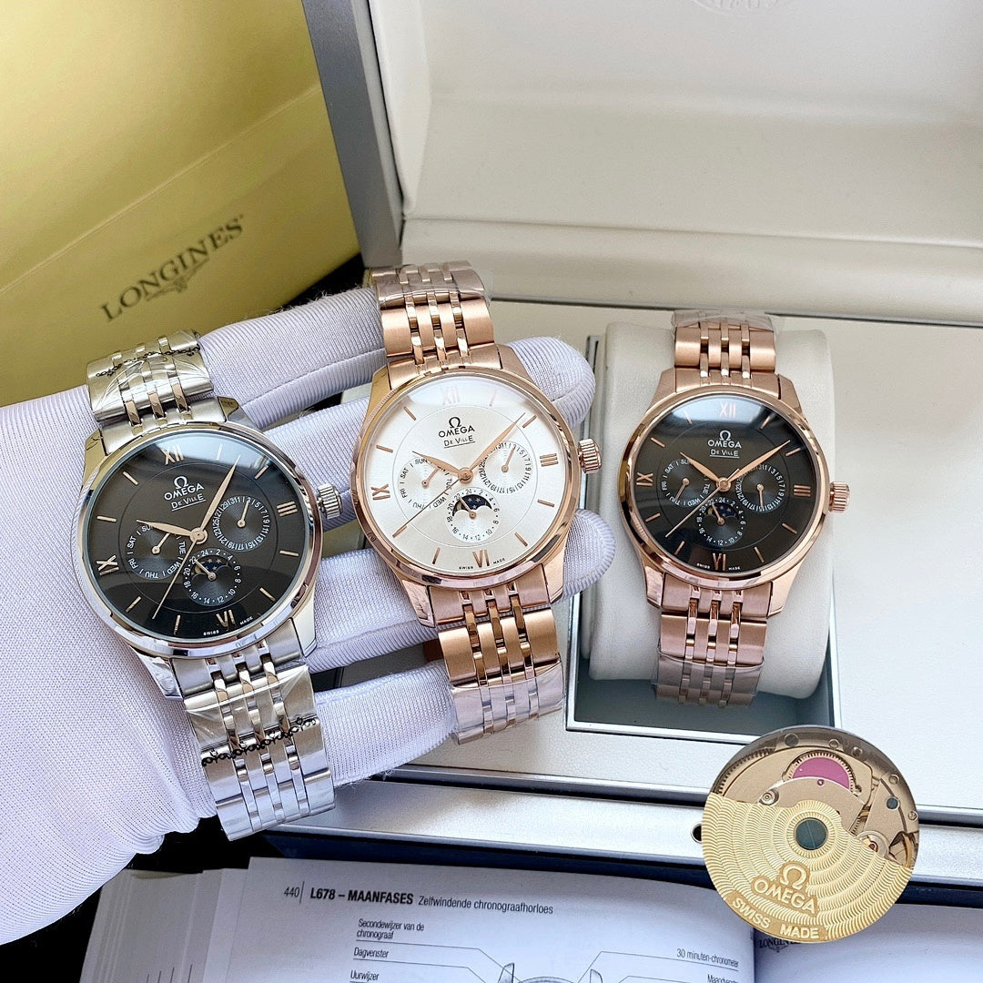Omega watches in three colors on display trays, with bracelets and round dials.