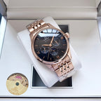 Omega watch with rose-gold metal bracelet and dark blue dial in white presentation box.