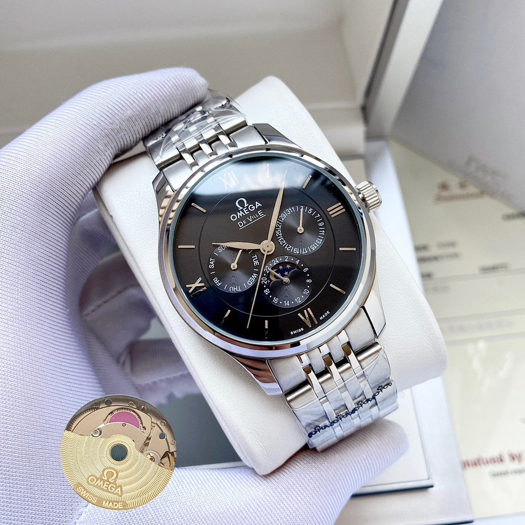 Omega watch with silver metal bracelet and dark blue dial on white display pillow.