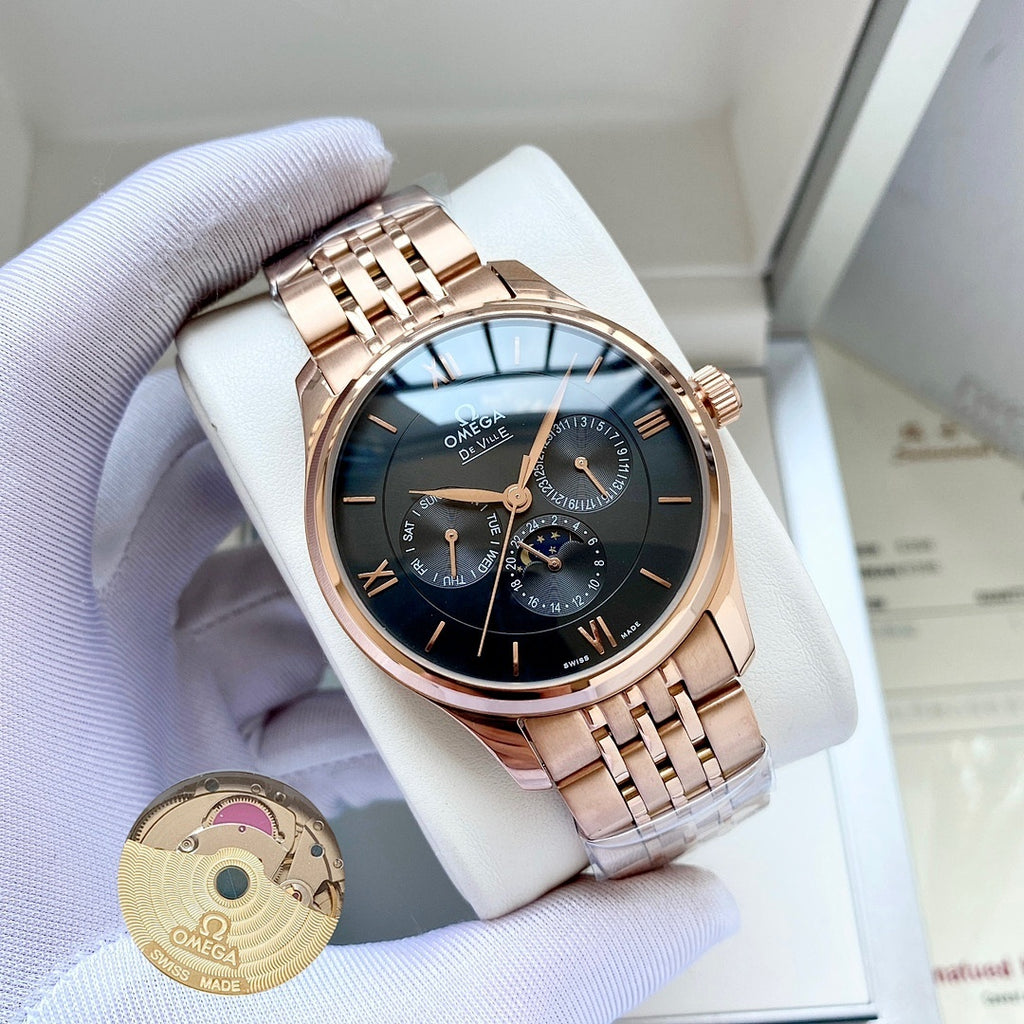 Omega watch with rose-gold metal bracelet and dark blue dial on white display pillow.