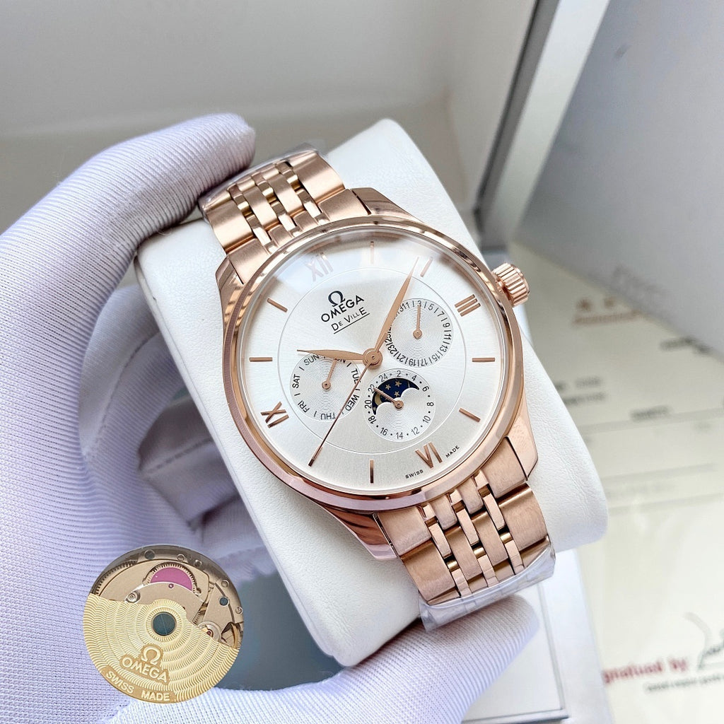 Omega watch with rose-gold metal bracelet and white dial on white display pillow.