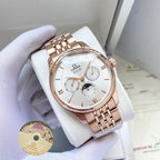 Omega watch with rose-gold metal bracelet and white dial on white display pillow.