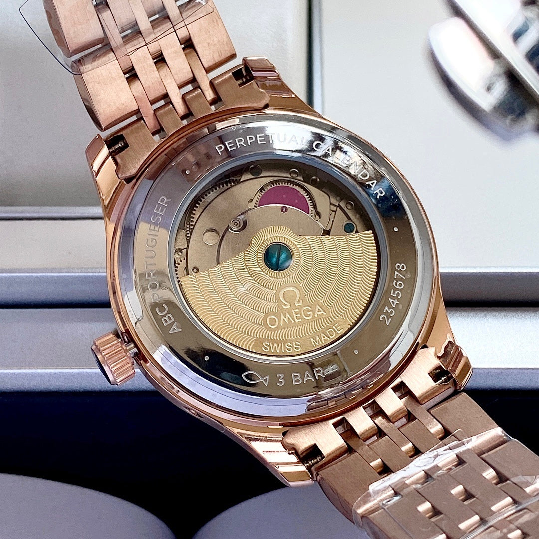Omega watch caseback in rose-gold with engraved text and gold-toned internal detail.