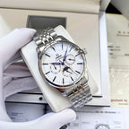 Omega watch with silver metal bracelet and white dial, subdials and crown visible