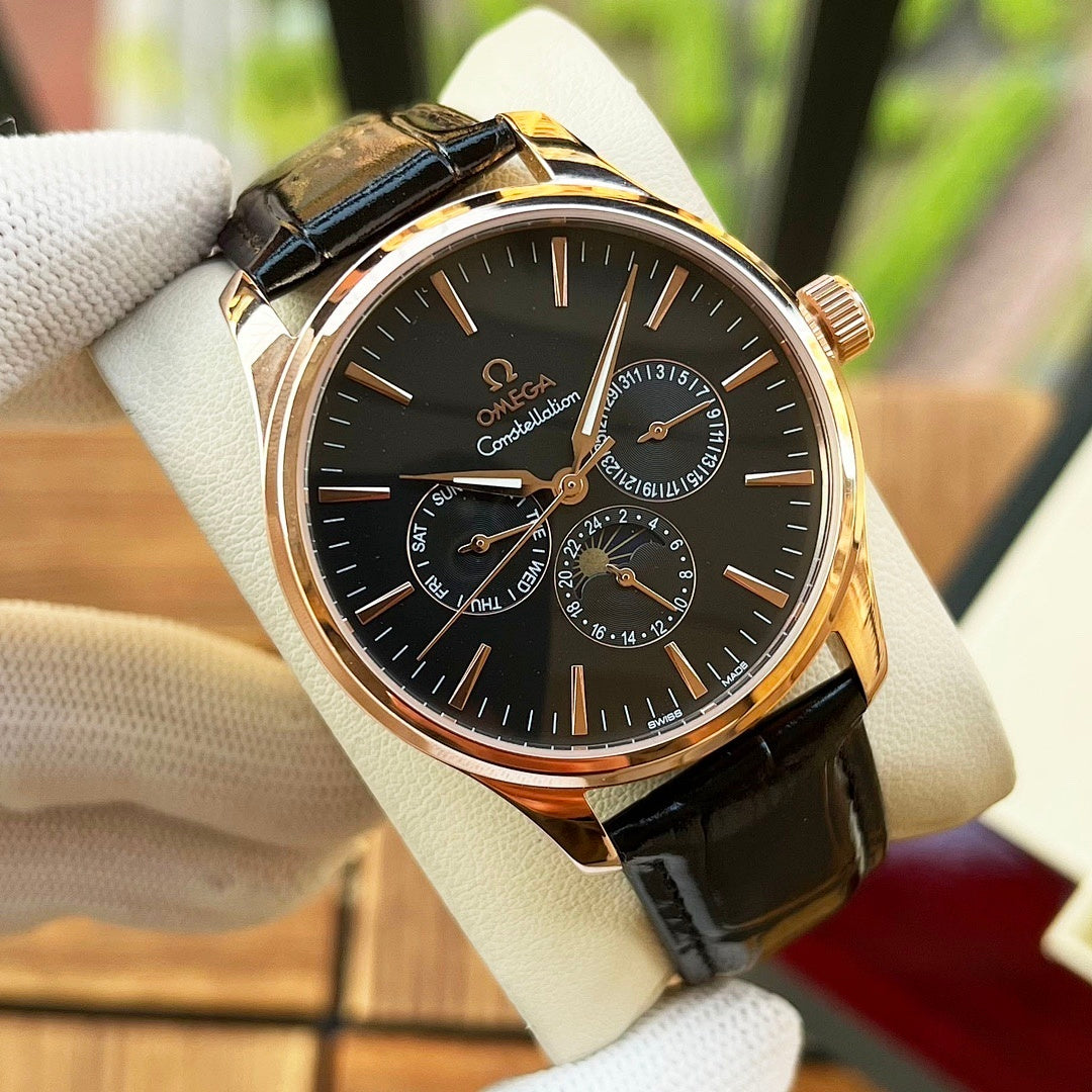 Omega watch with dark dial, black leather strap, gold-tone case and chronograph details