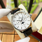 Omega watch with white dial, black leather strap, gold-tone case and subdials