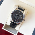 Omega watch with dark dial, black leather strap, silver case and chronograph subdials