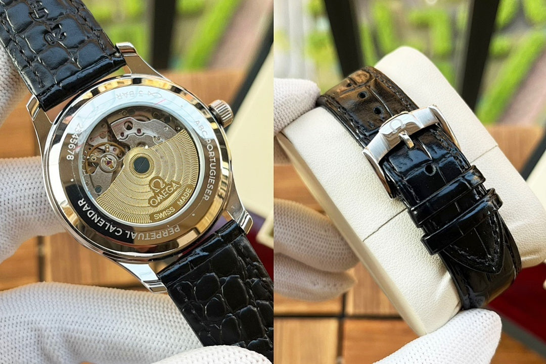 Omega watch with black leather strap and silver case back, two angles shown