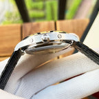 Omega watch side view with black leather strap, metal case and crown detail visible