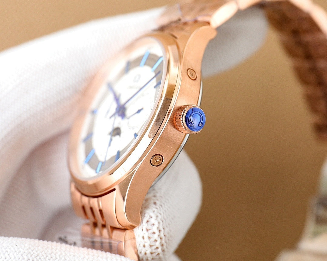 Rose gold Omega wristwatch with blue crown and white dial on white cloth