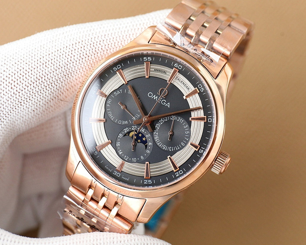 Rose gold Omega wristwatch with black dial and metal bracelet on white cloth