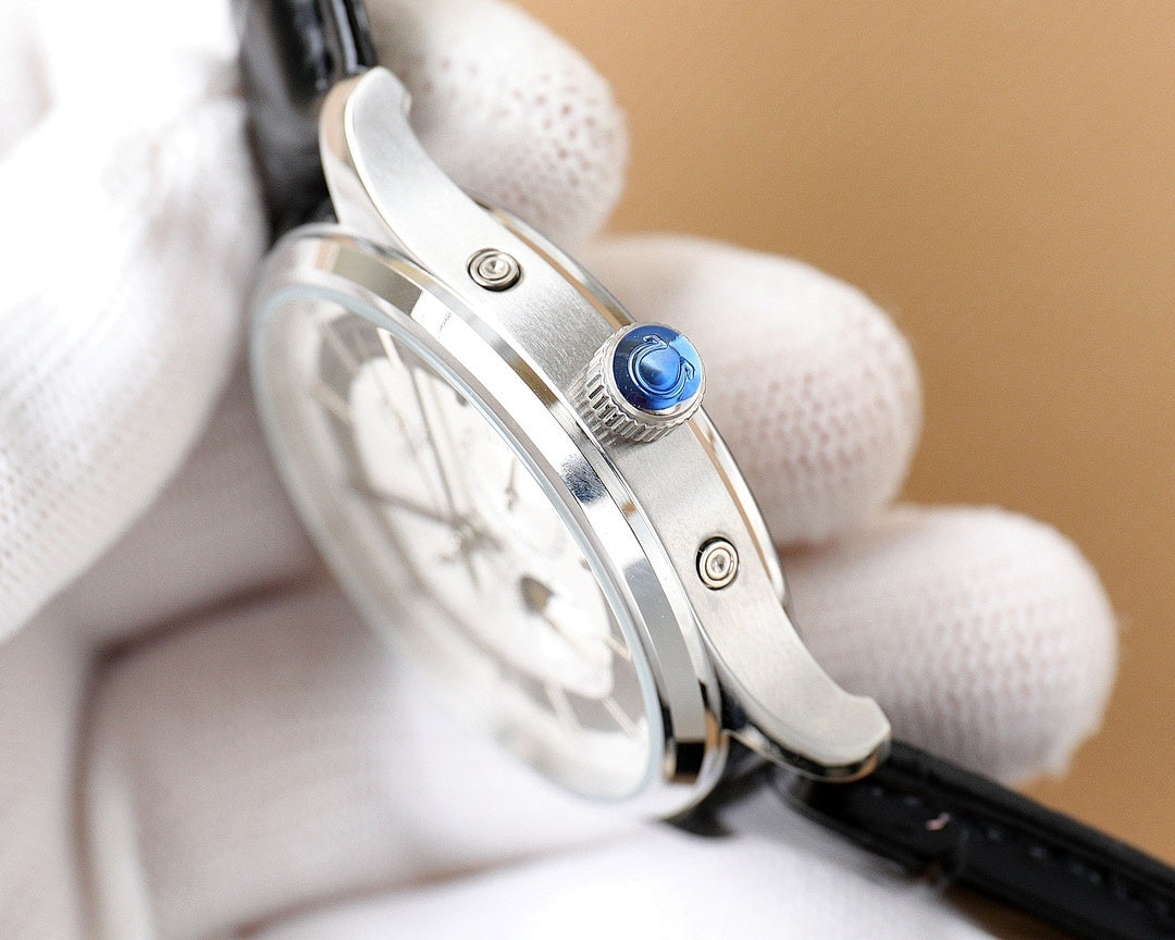 Omega watch angled view with blue crown detail and silver case; black leather strap.
