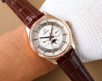 Omega wristwatch with rose-gold case, white dial, brown leather strap and subdials