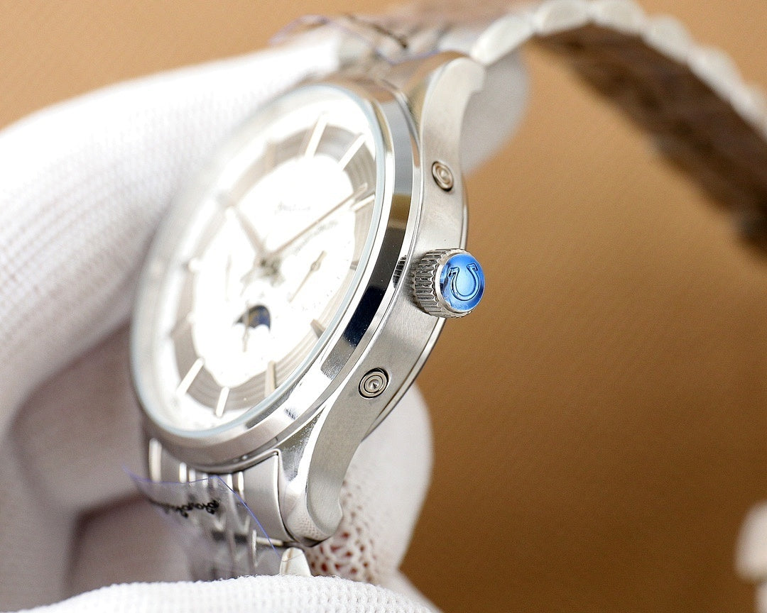 Omega watch crown and bezel closeup on silver case with blue detail
