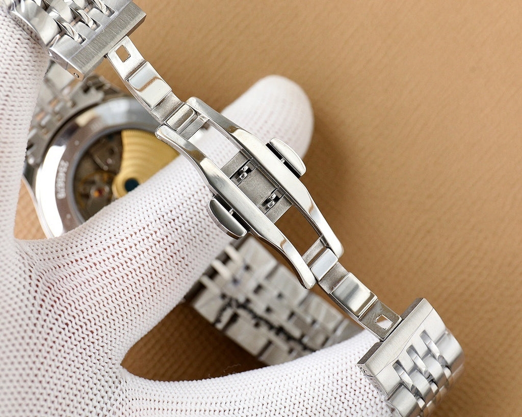 Omega watch side view with silver steel bracelet links and fold-over clasp