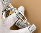 Omega watch side view with silver steel bracelet links and fold-over clasp