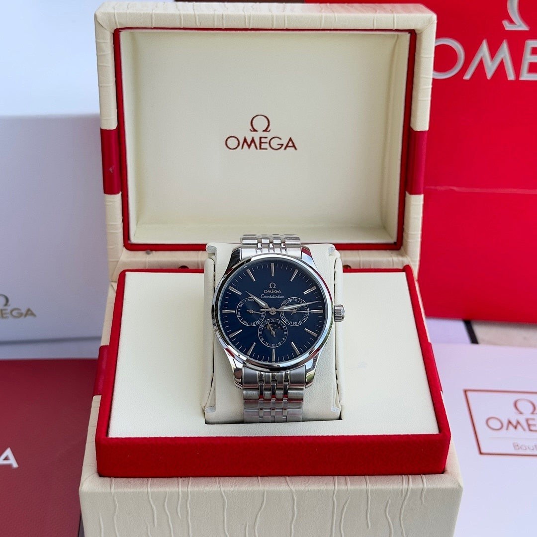 Silver-tone wristwatch with blue dial and metal link bracelet in open box
