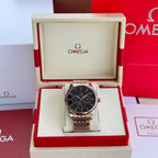 Silver-tone wristwatch with black dial and metal link bracelet in display box