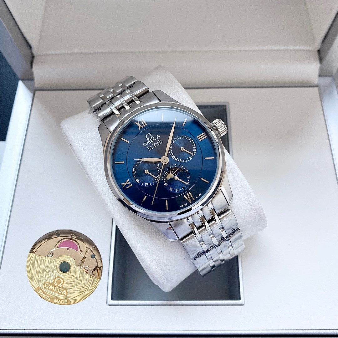 Omega wristwatch with blue dial and silver metal bracelet on white watch cushion