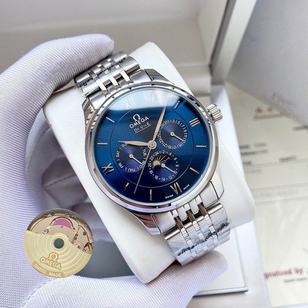 Omega wristwatch with blue dial and silver metal bracelet on a white pillow