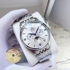 Omega wristwatch with white dial and silver metal bracelet on a white display cushion