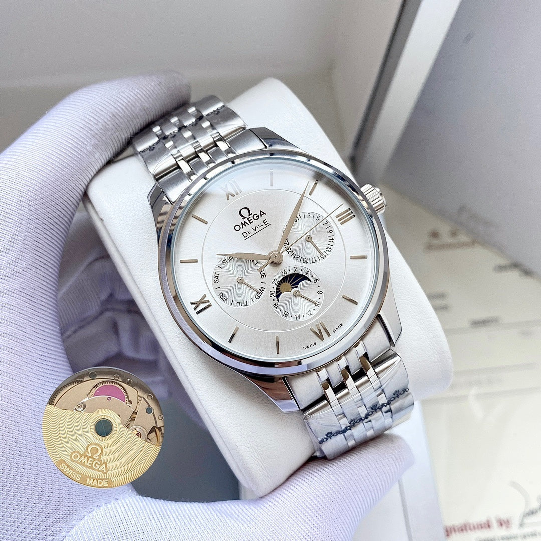 Omega wristwatch with silver-tone metal bracelet and white dial on a white pillow
