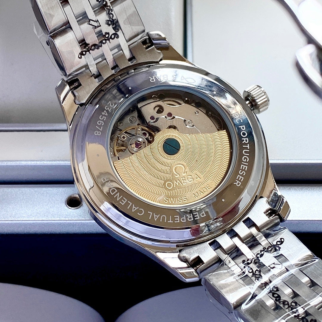 Omega wristwatch open case view with gold-toned movement and silver metal bracelet