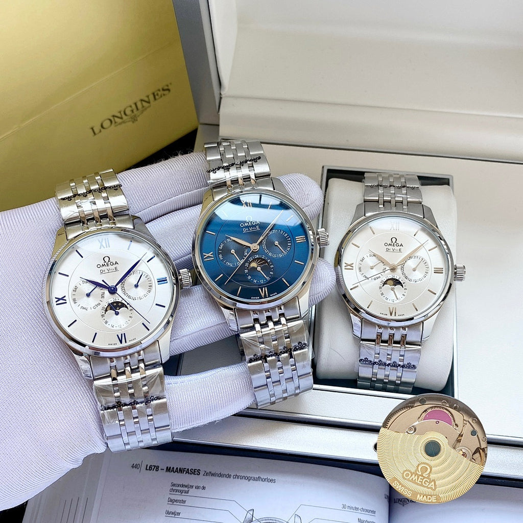 Set of three Omega wristwatches with silver metal bracelets in a white display box