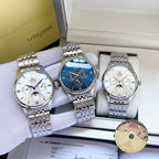Set of three Omega wristwatches with silver metal bracelets in a white display box