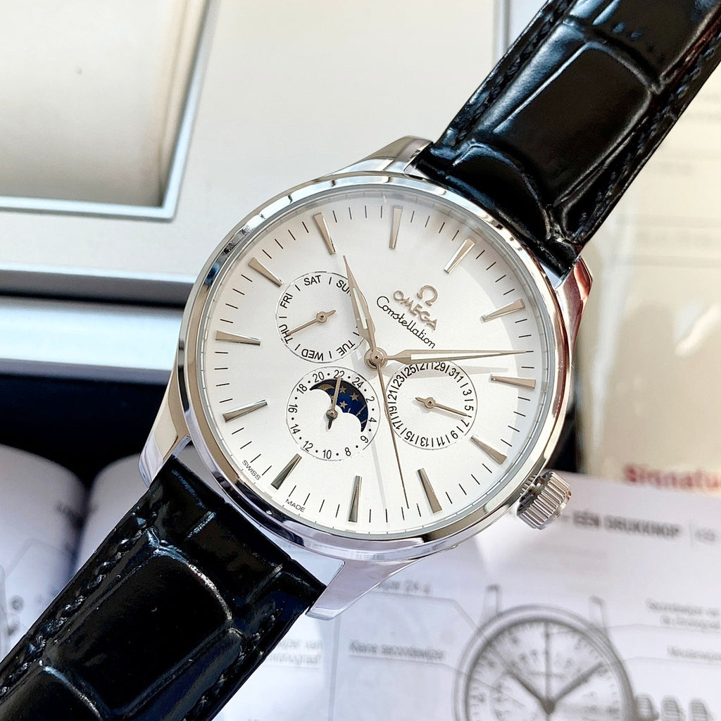 Omega wristwatch with white dial and black leather strap, silver case, subdials