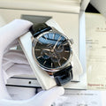 Omega wristwatch with black leather strap and blue dial, silver case, subdials