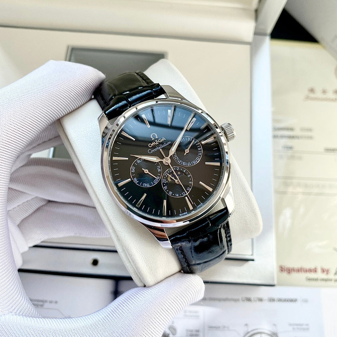 Omega wristwatch with black leather strap and blue dial, silver case, subdials