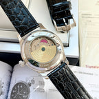 Omega watch case back with open movement display, black leather strap, silver bezel