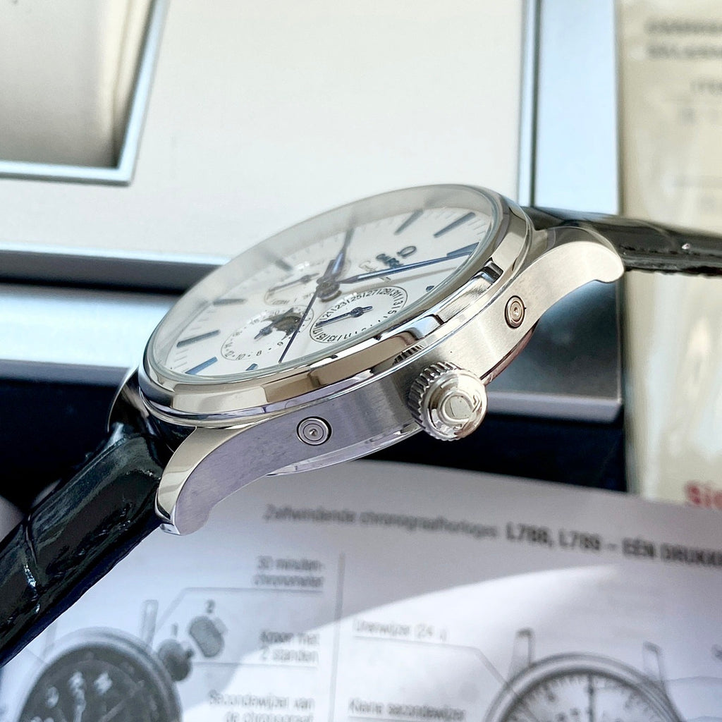 Omega wristwatch side view with crown and black leather strap, silver case