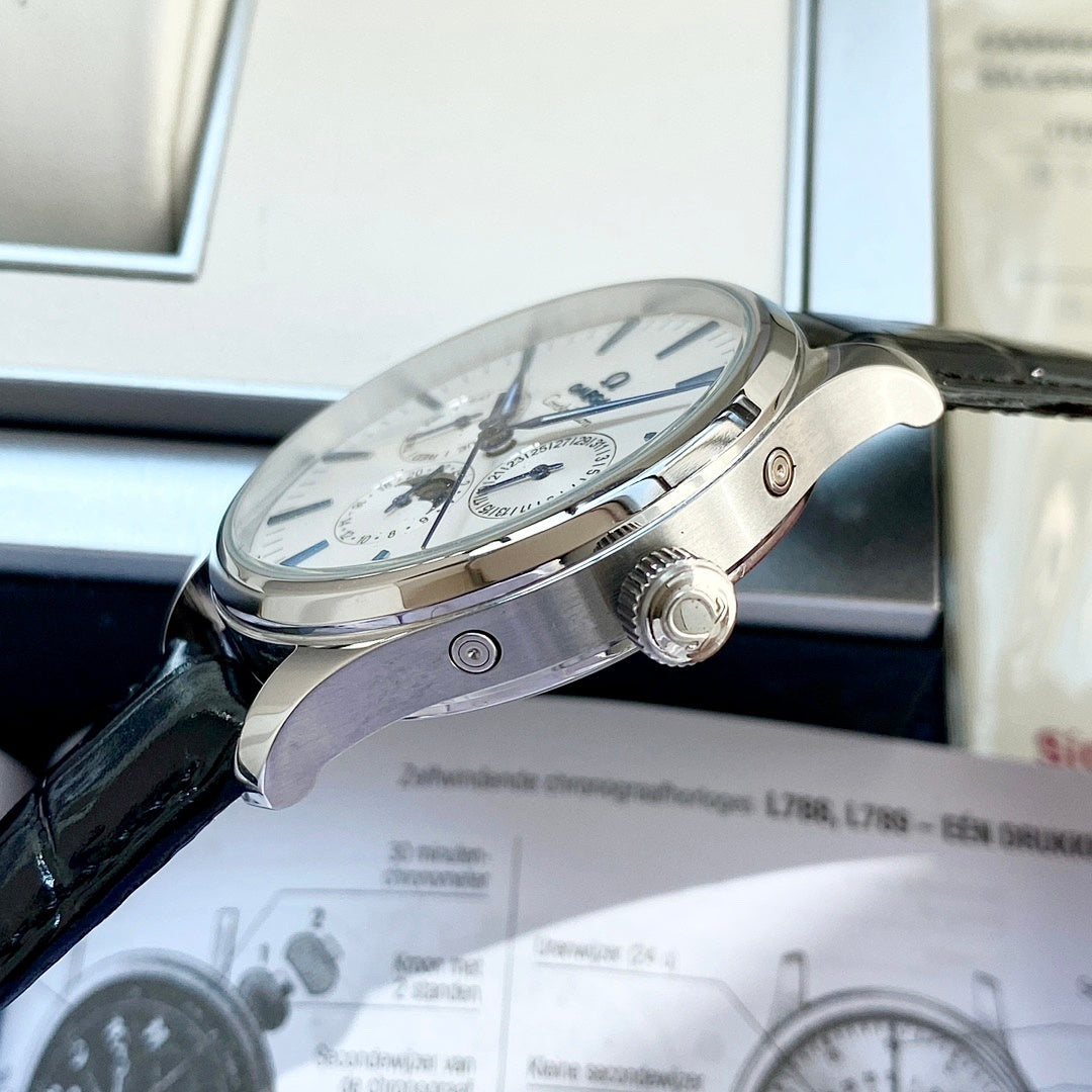 Omega wristwatch side view with crown and black leather strap, silver case