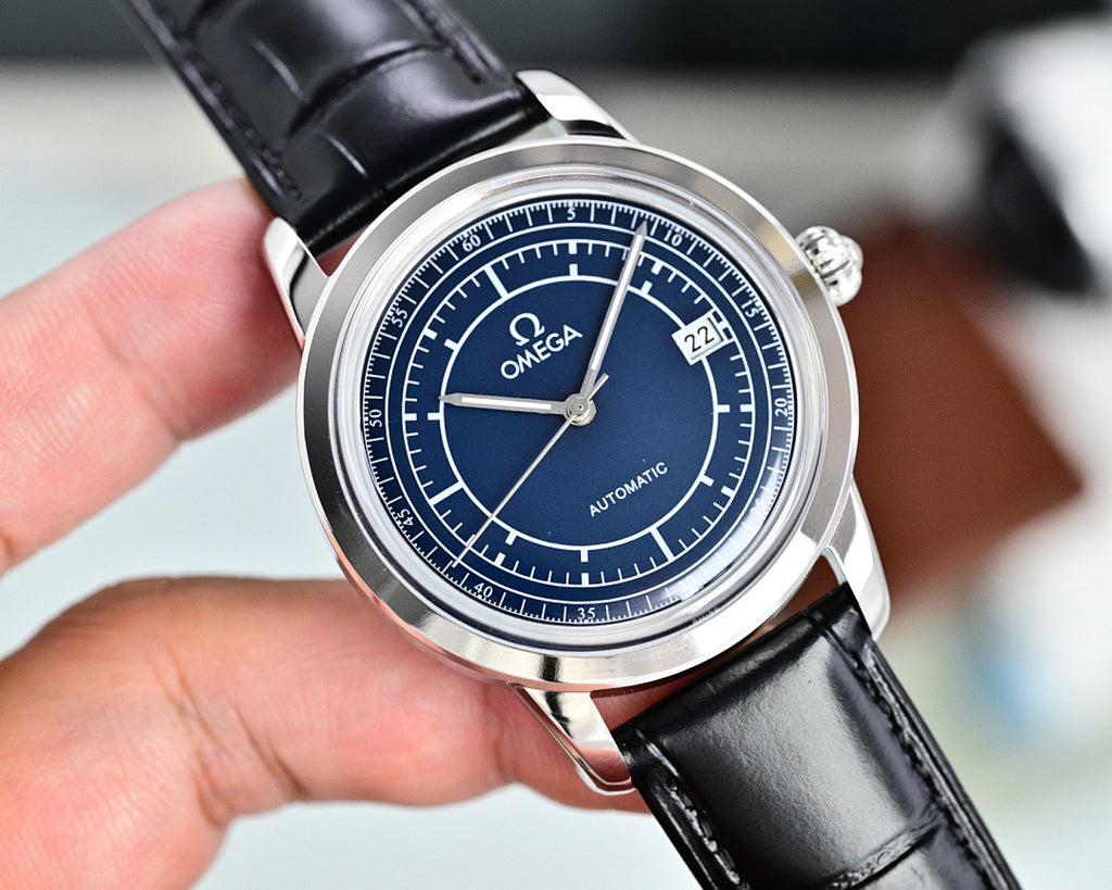 Automatic Omega watch with blue dial, silver case, and black leather strap