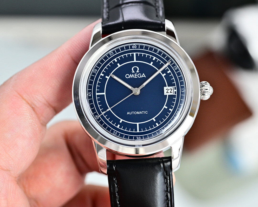 Automatic watch with blue dial, silver case, black leather strap, and date marker