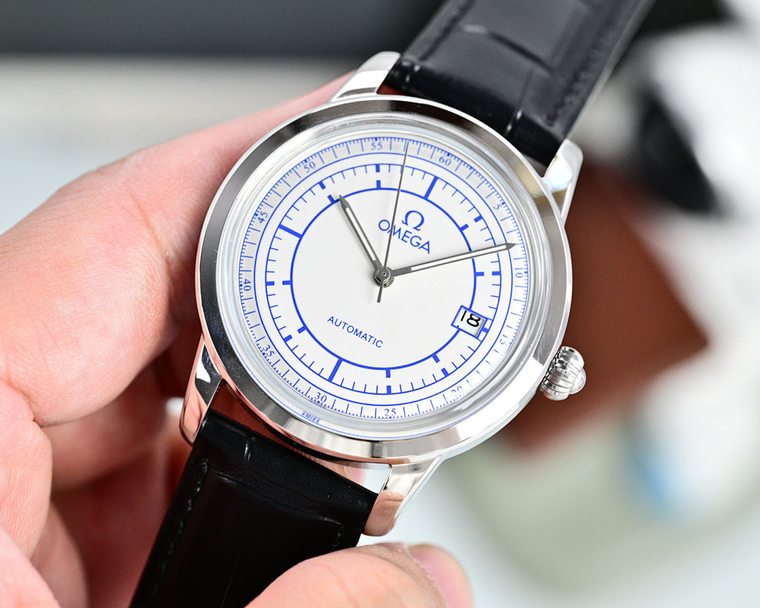 Automatic watch with blue dial, silver case, and black leather strap, crown visible